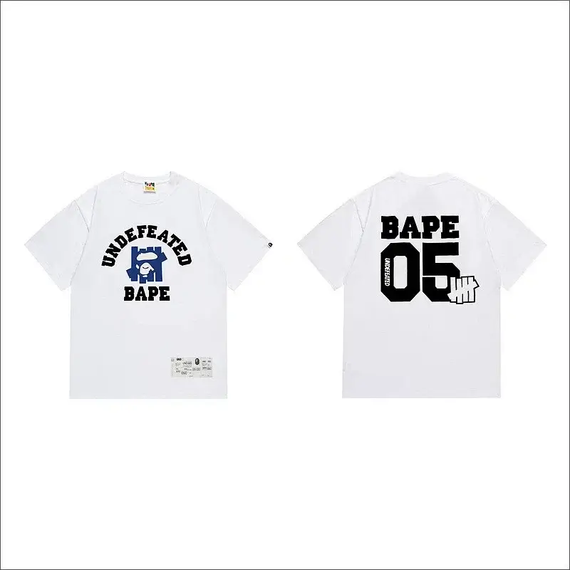 BAPE x UNDEFEATED White T - Shirt with Front UNDEFEATED Arc Text, Blue Logo & BAPE, Back BAPE 05 & UNDEFEATED Fist Logo
