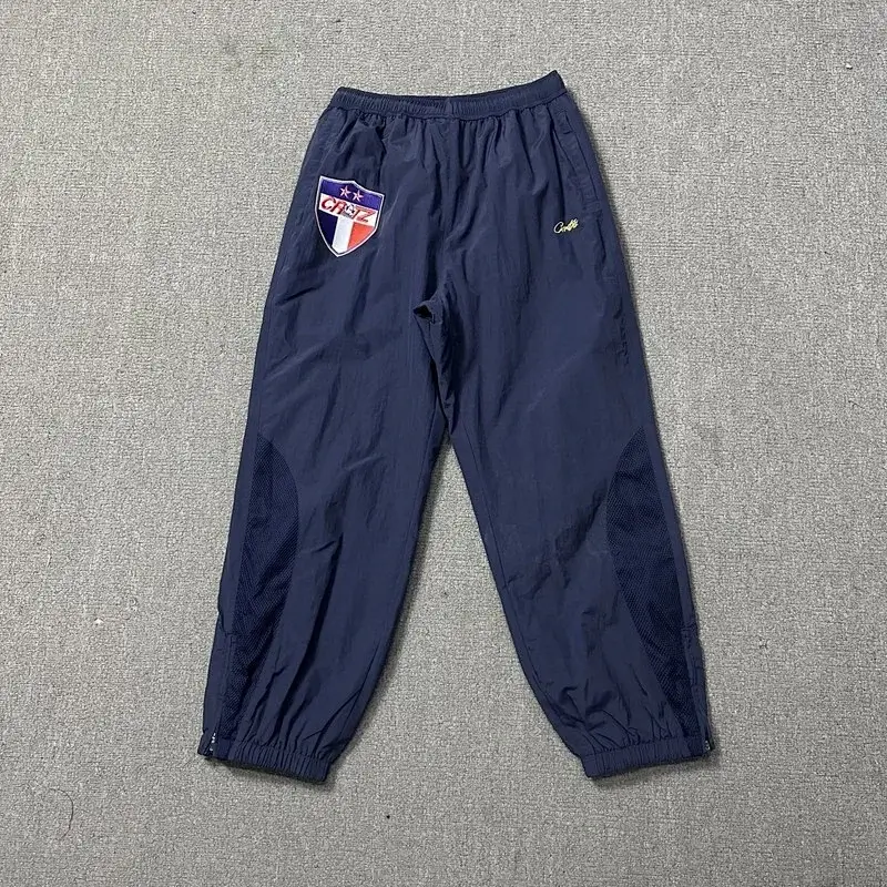 Cruz Navy Blue Mesh Panel Track Pants with Badge Logo & Elastic Cuffs