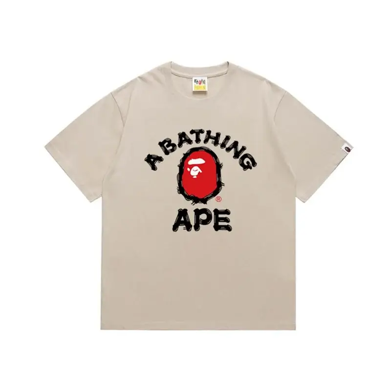 A BATHING APE Beige T - Shirt with Red Ape Head Logo and Black "A BATHING APE" Text